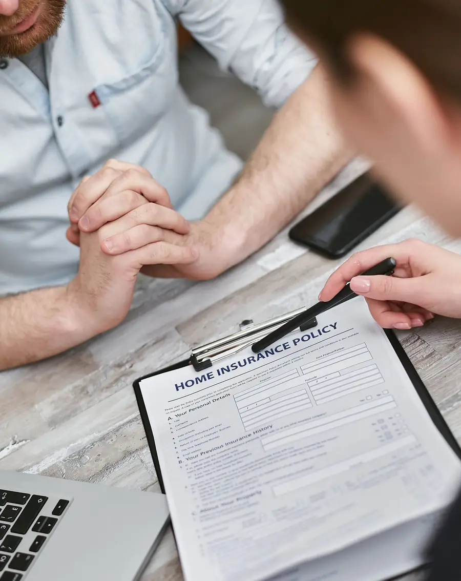 Homeowner and agent going over an insurance form